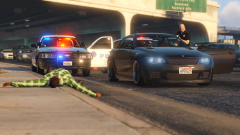 Officer clearing a vehicle after a shooting with a suspect