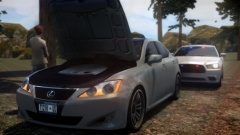 Un Marked Charger stops to help out a motorist