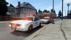 Two LCPD vehicles outside a residence.