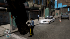 Sheriff's Deputy checks a burnt out vehicle