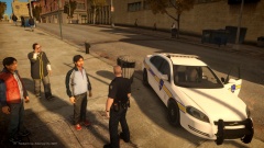 Liberty Sheriff's Ofice [LSO] Officer seen interacting with a man on a sidewalk.