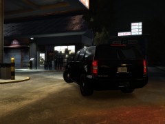 Government SUV pulling to a gas station