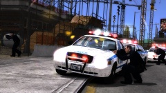 NYPD surrounding a downed suspect