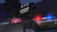 A cop car flying in the air, nothing weird about that