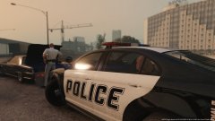 Highway patrol officer cleaning up scene after pursuit (1)