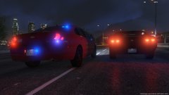 A Trooper in an unmarked car passes a motorist who failed to yield, as he attempts to catch up to a pursuit.