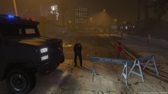 A Deputy blocks the road, as Los Santos Fire Rescue works on a structure fire.