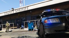 Coroner cleaning up the scene of a police station shootout