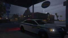 A SC State Trooper takes shelter from the weather