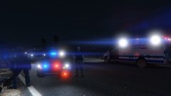 A deputy helps block the road after finding a stabbing victim