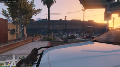 Grove Street Gang hiding behind a police car