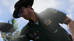 Area Commander Alex Colton - Reaching down to inspect the dirt