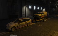 Holden Sportswagon towing a Toyota Hilux paddywagon