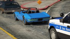 stuck at a red light behind a custom coquette