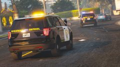 California Highway Patrol officers pursue a kidnapper in a blue sedan.