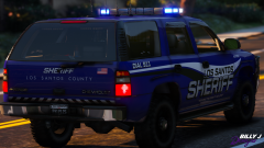 Blue and silver 2006 Chevy Tahoe