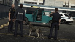 Officers inspecting a suspicious vehicle