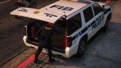 K-9 Officer checks equipment