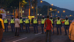 Crowds begin to gather at a protest outside City Hall
