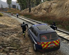 French gendarmes chasing a suspect