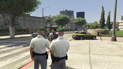 Guardia di Finanza with an arrested suspect.