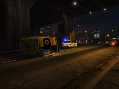 Ambulance flipped itself despite the police escort.