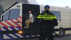 Dutch officers transporting a suspect