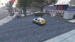 South Wales Armed Police On Scene At A Store Robbery