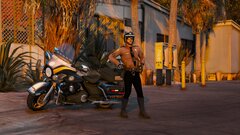 FHP Motor Officer Next to a 2013 Harley Davidson