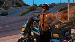 FHP Motor Officer Next to a 2013 Harley Davidson