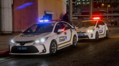 Two police cars of the patrol police of Ukraine on a call about an attack