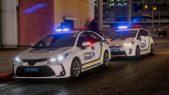 Two police cars of the patrol police of Ukraine on a call about an attack