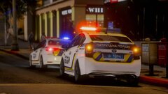 Two police cars of the patrol police of Ukraine on a call about an attack